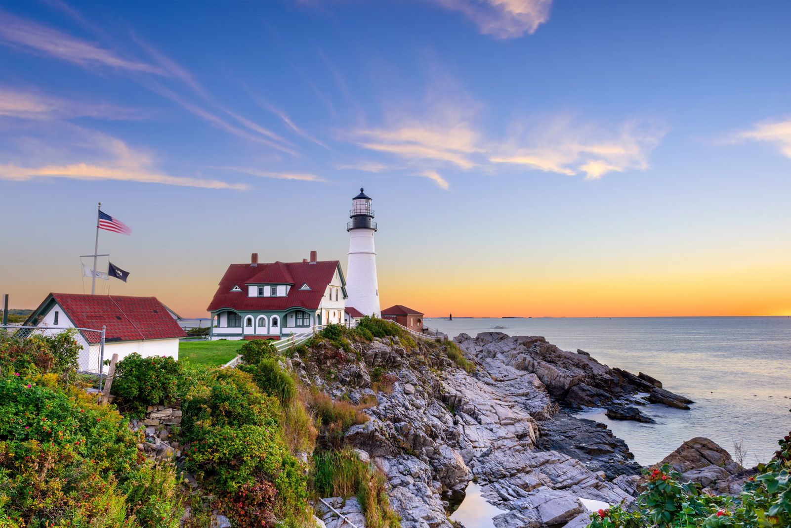 Lighthouse against the sunset on coast of maine