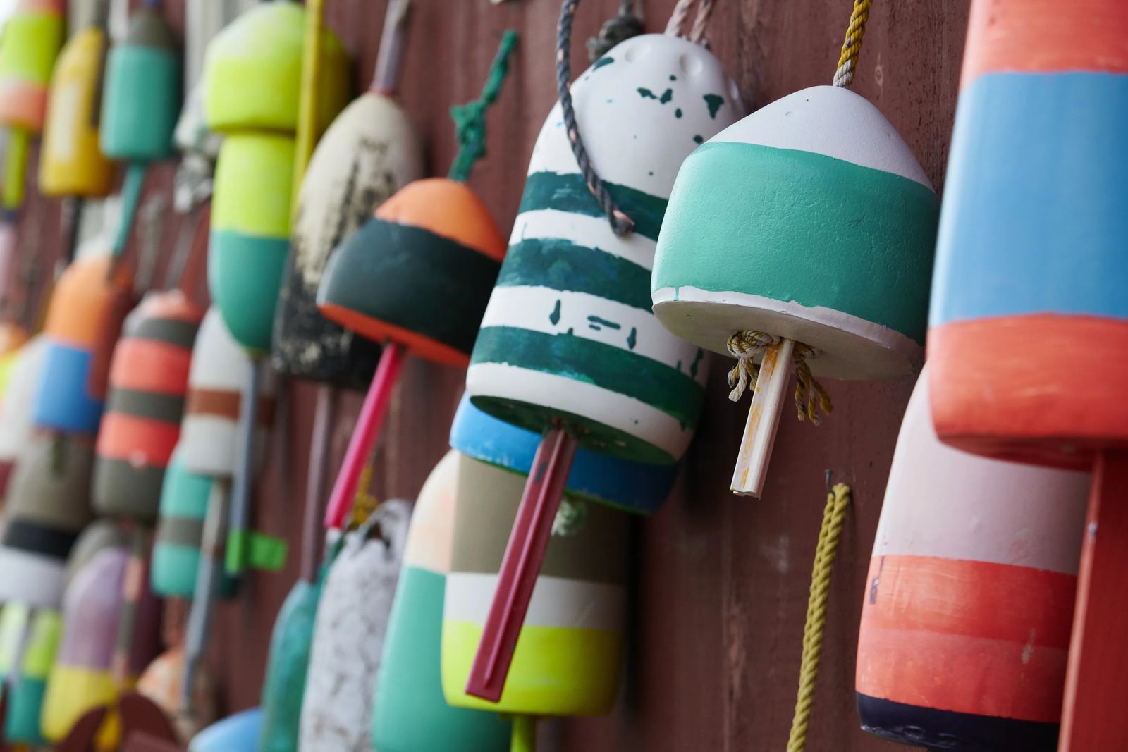 Hanging colorful lobster bouys on the coast of maine