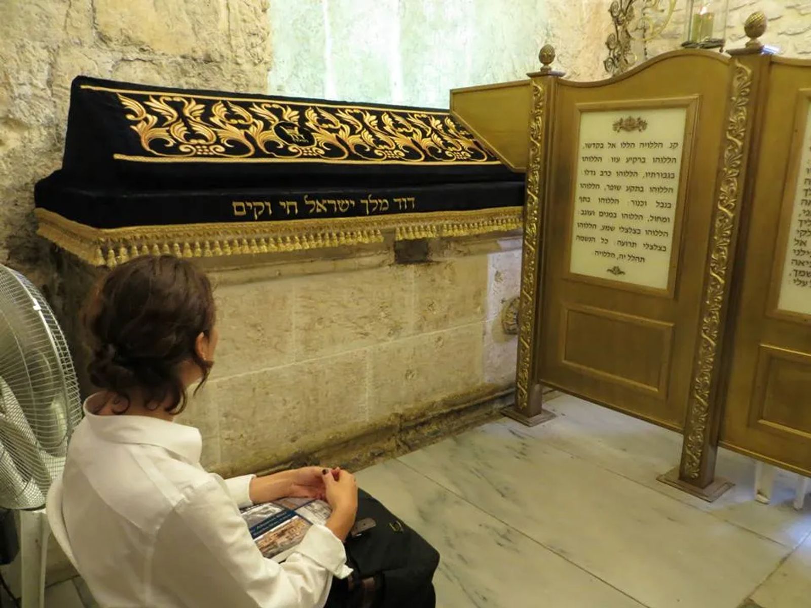 Woman sitting near King David's Tomb in Jerusalem
