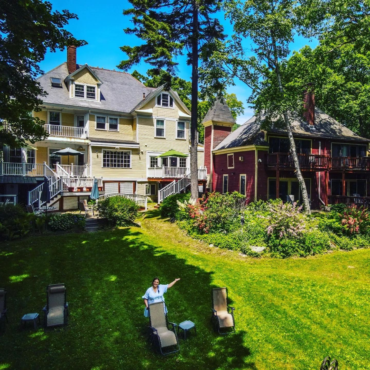 drone shot of Janiel in the backyard of Hawthorn Inn Mansion in Camden Maine