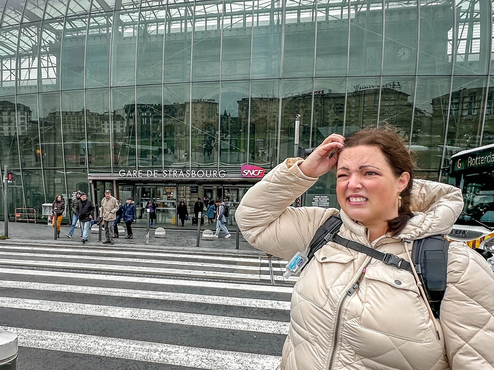 woman confused in front of train station