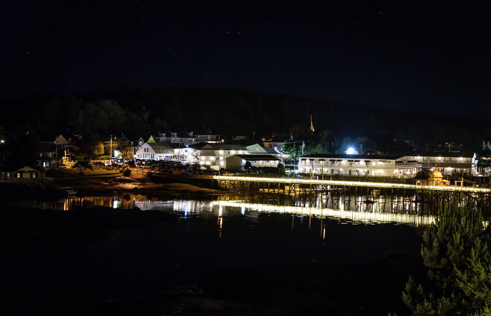 twinkling lights on a bridge at Boothbay at sunset