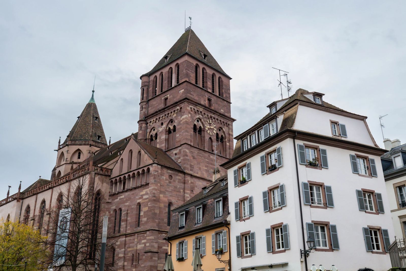 10 story red brick cathedral on cloudy day
