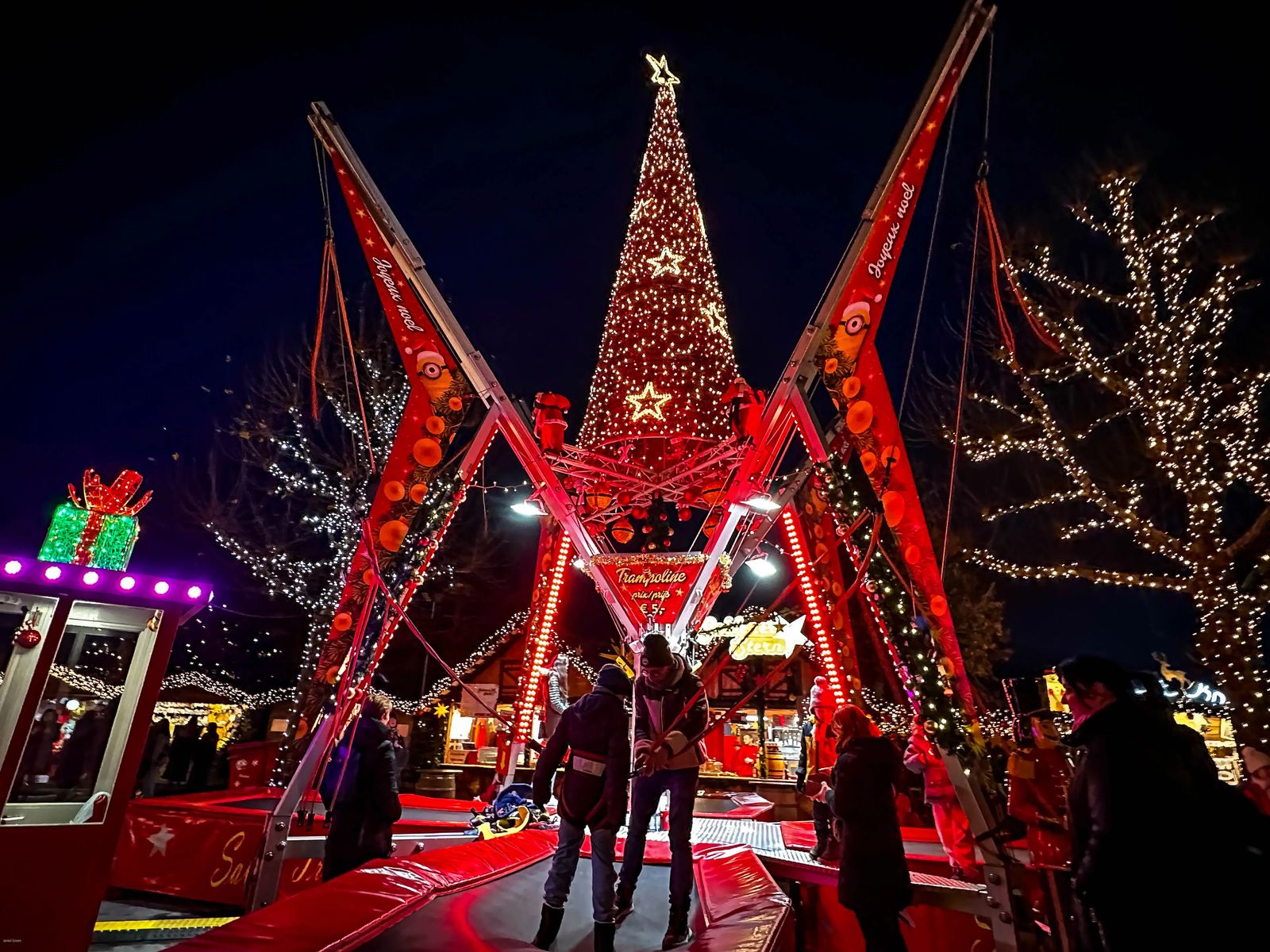 Trampoline christmas tree ride at christmas market