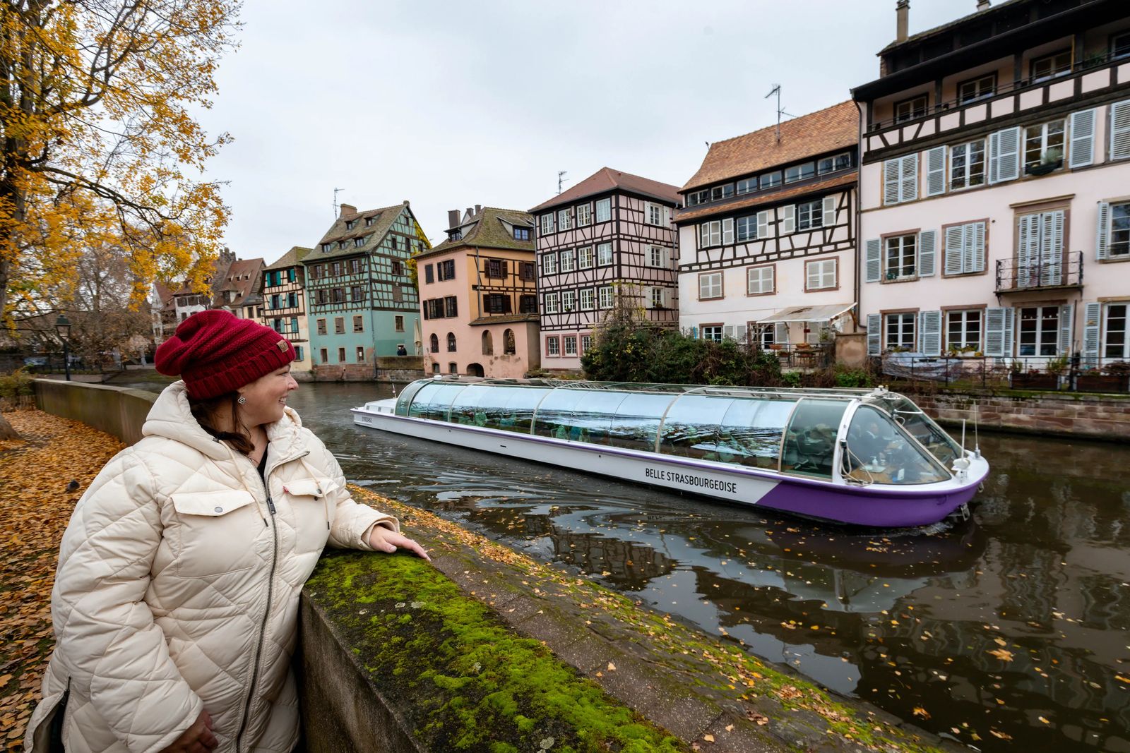 woman with boat with colorful homes Best Things To See In Strasbourg France