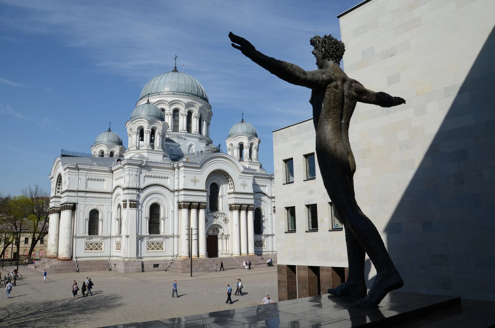 Things to do in Kaunas, statue of man with arms out in front of the church