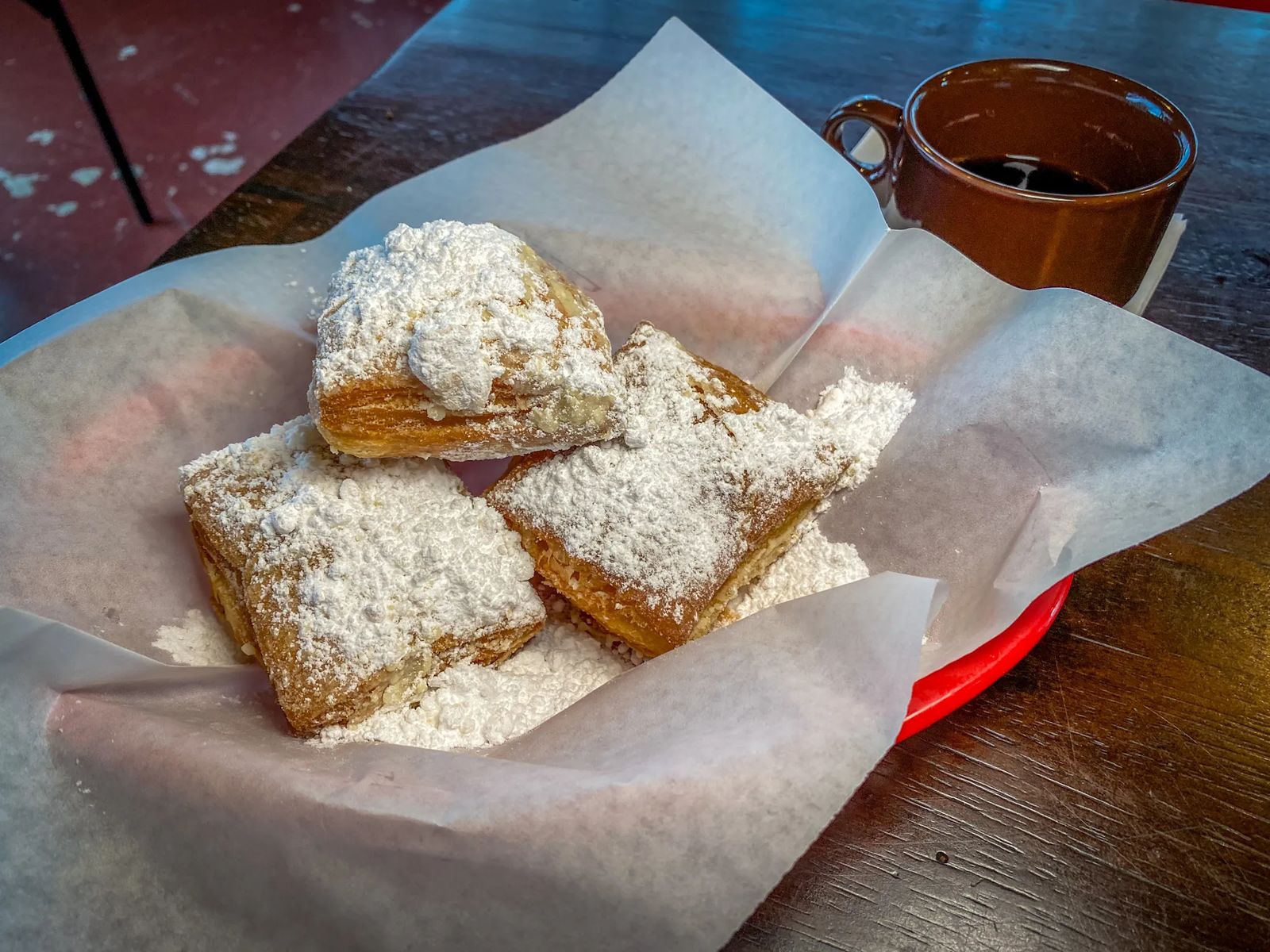 Fluffy Beignets with powdered sugar and coffee