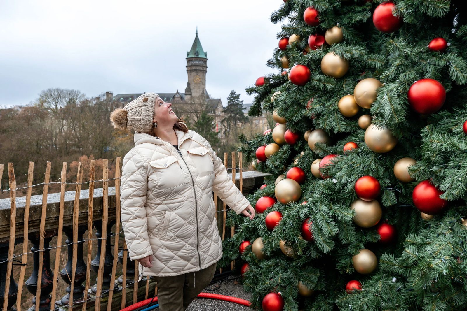 Janiel looking at large Christmas Tree