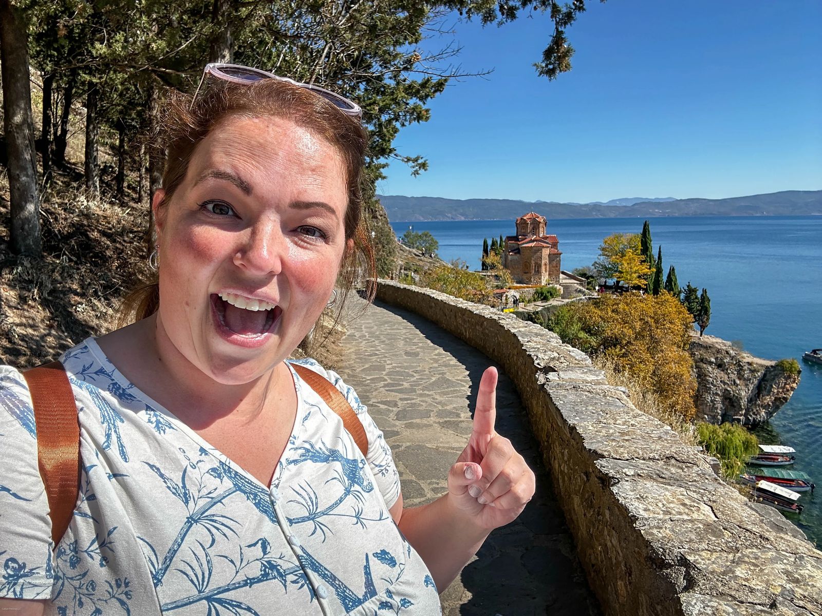 woman in front of St John of Kaneo