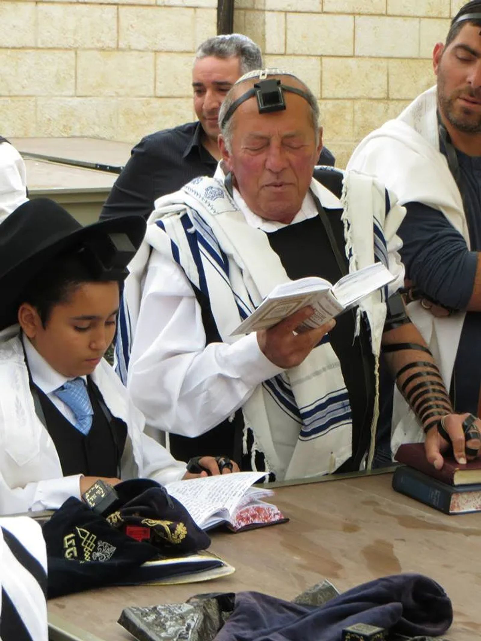 Men Reading from the Torah at the Western Wall in Jerusalem