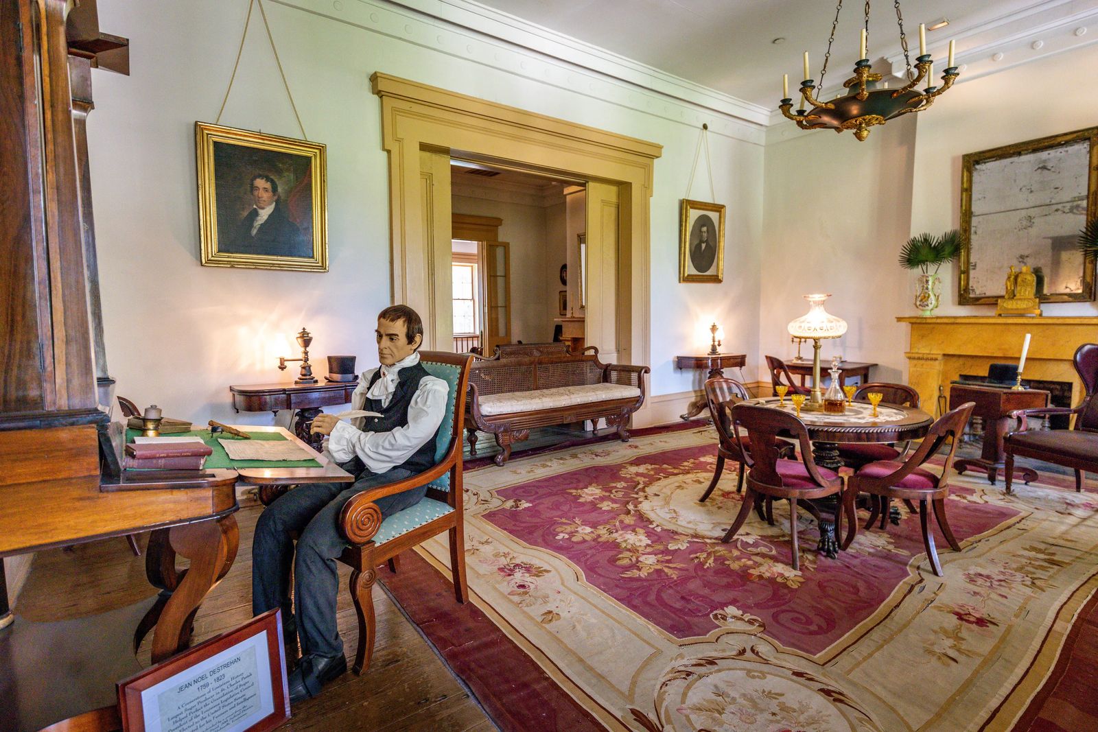 Jean Noel Destrehan statue at desk on Destrehan Plantation Tour