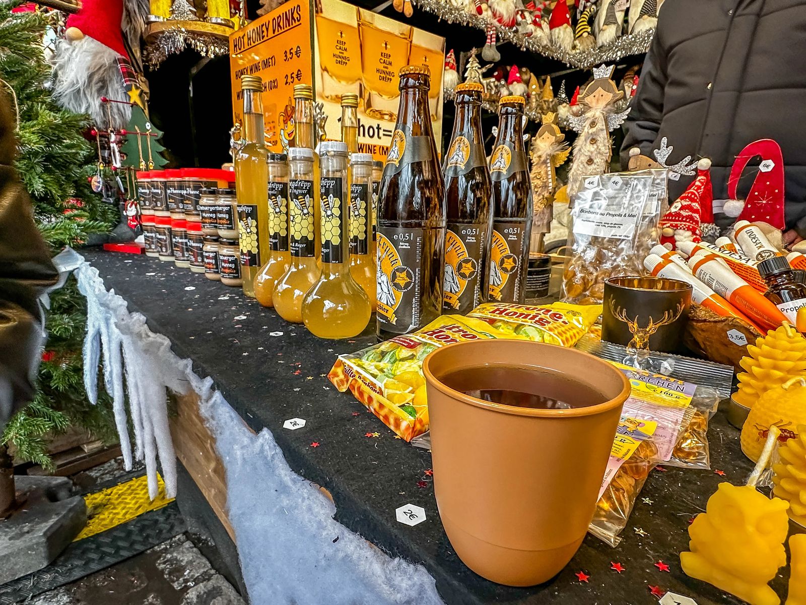 Cup of Mead with items made from honey behind it