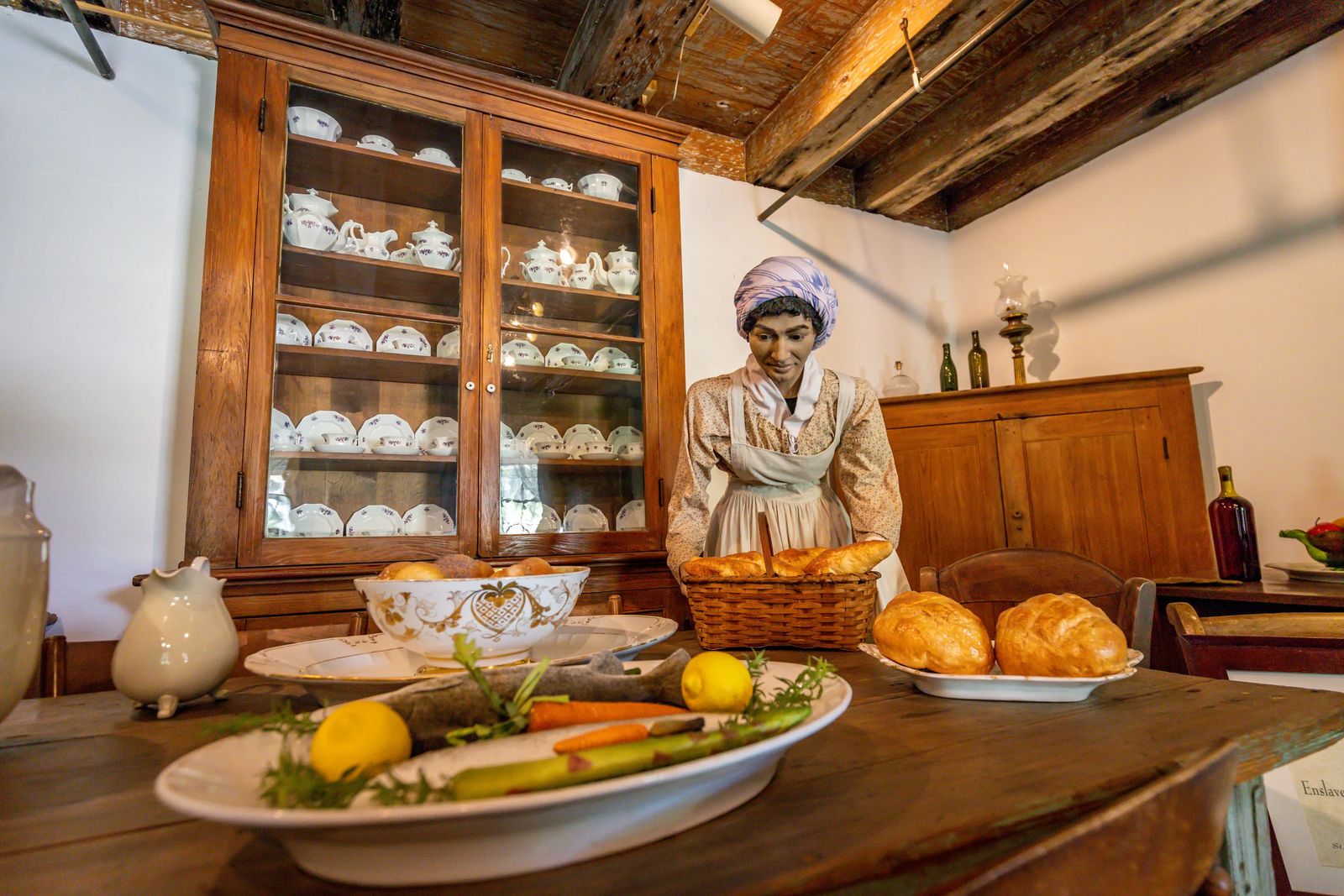 Statue of slave woman preparing food on Destrehan Plantation Tour